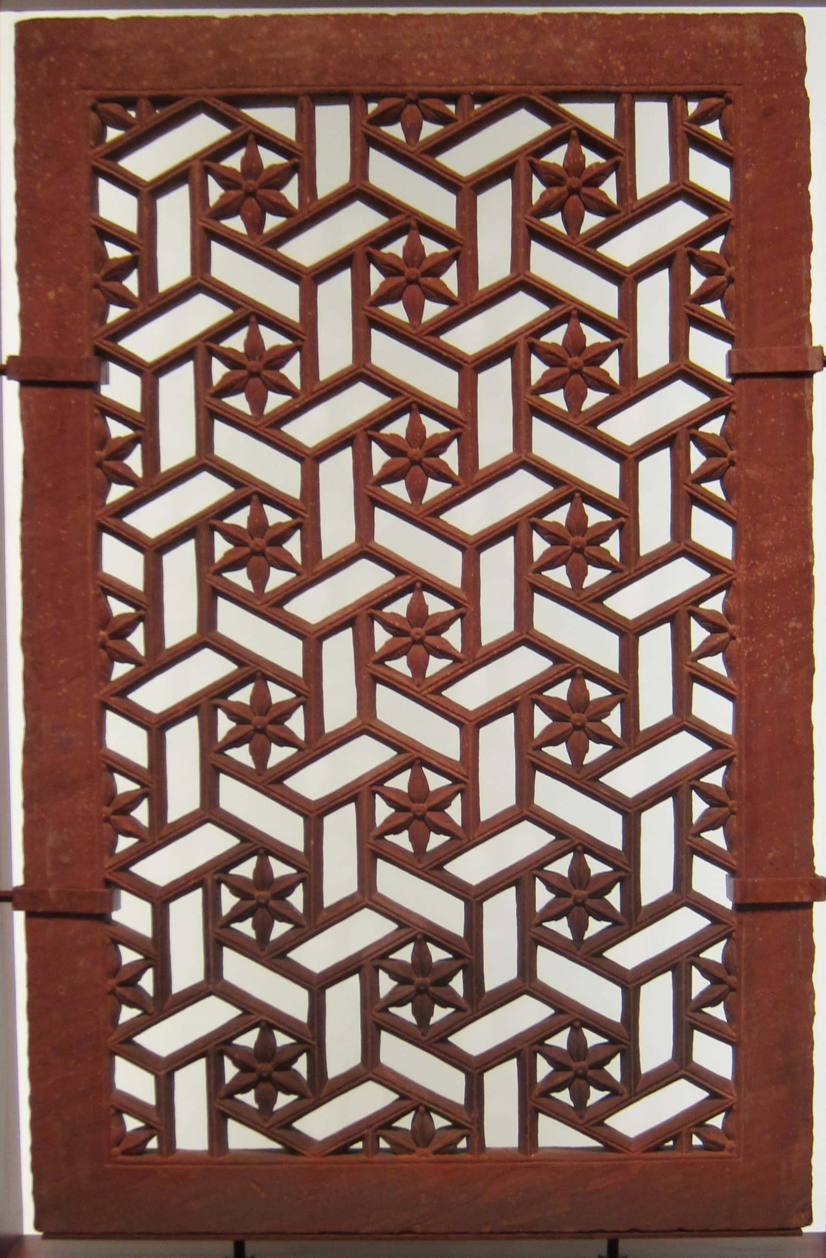 A carved sandstone jali screen