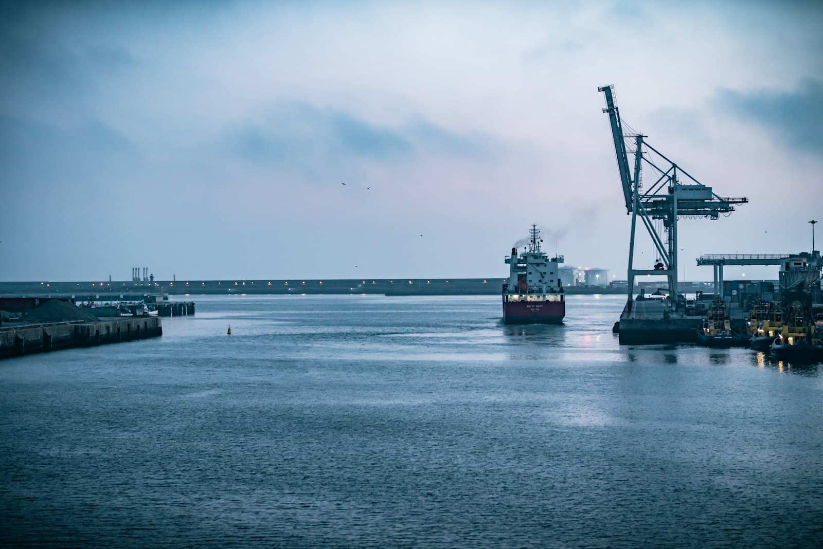 Port cranes at dusk